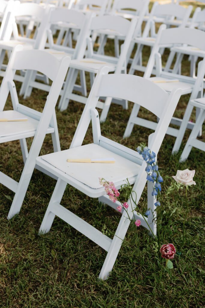 Outdoor ceremony with florals at this Texas wedding.