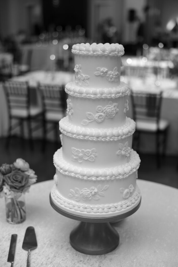 4 tier elegant wedding cake at the reception of a Texas wedding.