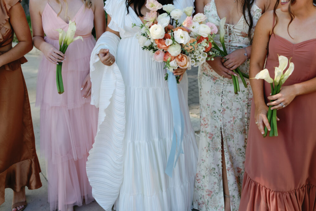 Colorful bridesmaids dresses at a spring Texas wedding.
