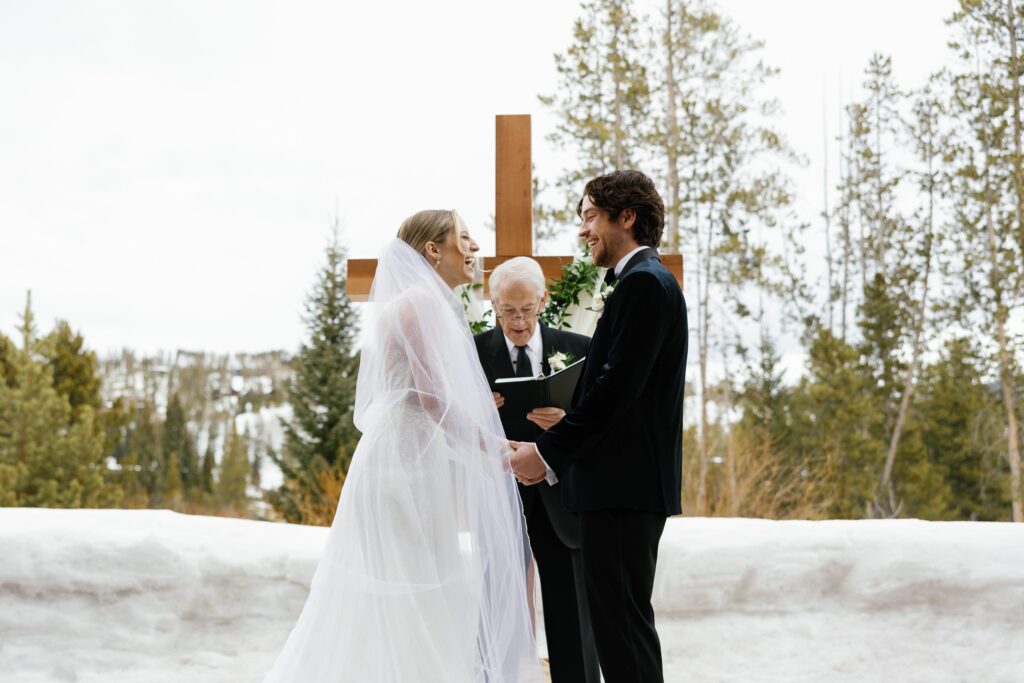 A Colorado bride & groom during their wedding ceremony in Winter Park, Colorado. 